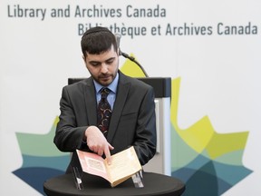 Michael Kent, curator of the Jacob M. Lowy collection, displays the German language book "Statistics, Media and Organizations of Jewry in the United States and Canada," Wednesday January 23, 2019 in Ottawa. The book, once owned by Adolf Hitler, has been acquired by Library and Archives Canada.