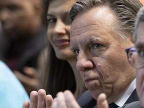 Quebec Premier François Legault, right, and Public Security Minister Geneviève Guilbault during a memorial ceremony to honour the victims of the 2017 mosque shooting Tuesday in Quebec City. Two days later, Legault says there is no islamophobia in Quebec, contradicting Guilbault who said the government would look at the idea of a day against islamophobia.