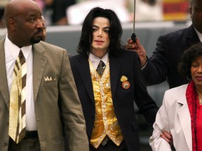 FILE - In this May 25, 2005 file photo, Michael Jackson arrives at the Santa Barbara County Courthouse for his child molestation trial in Santa Maria, Calif. A documentary film about two boys who accused Michael Jackson of sexual abuse is set to premiere at the Sundance Film Festival later this month. The Sundance Institute announced the addition of "Leaving Neverland" and "The Brink," a documentary about Steve Bannon, to its 2019 lineup on Wednesday. The Sundance Film Festival kicks off on Jan 24 and runs through Feb. 4.