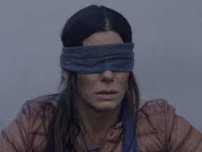 Sandra Bullock in a scene from the film Bird Box: For the sake of humankind, please don't try this behind the wheel.