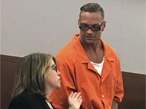 Nevada death row inmate Scott Raymond Dozier, right, confers with Lori Teicher, a federal public defender involved in his case, during an appearance in Clark County District Court in Las Vegas. Authorities say the 48-year-old Nevada death-row inmate who wanted for two years to die, but whose execution was postponed twice, has been found dead in his cell on Saturday, Jan. 5, 2019, from an apparent hanging.