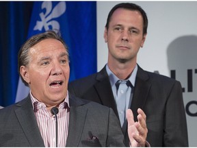 Premier François Legault with Education Minister Jean-François Roberge. They've sealed Riverdale's fate, leaving no room for discussion or compromise, Allison Hanes writes.