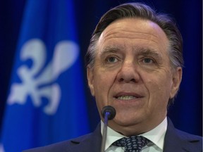 Premier François Legault says the CAQ's proposed ban on the wearing of religious symbols is reasonable compared with measures elsewhere.