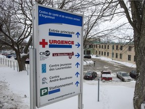 The English words on the sign at the regional hospital have been covered Wednesday, January 9, 2019 in Lachute, Que. Administrators of the hospital 80 kilometres northwest of Montreal announced they would eliminate the English signs that have been posted for years, in order to comply with Quebec's language law, Bill 101.