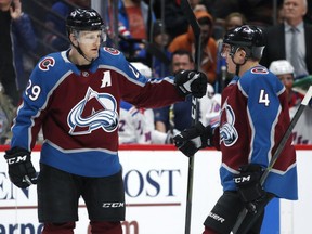 Avalanche centre Nathan MacKinnon, left, is congratulated after scoring a goal by defenceman Tyson Barrie. MacKinnon deftly handled a mild controversy he started by lashing out at his coach during a game this week.