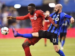 Toronto FC forward Jozy Altidore (17) battles for the ball with Montreal Impact defender Laurent Ciman (23) during first half action in the first leg of the MLS Eastern Conference final at the Olympic Stadium in Montreal on November 22, 2016. Toronto FC defender Laurent Ciman says while he has nothing but respect for his former team in Montreal as well as its fans, he wears red now. "Now my club is Toronto," he said in French. "Everybody knows very well I give everything for the club." And the Belgian international said while he understands the rivalry between the two Canadian clubs, playing Montreal will be a match like every other for him.