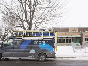 A truck from Énergir, formerly known as Gaz Métro, sits outside École des Découvreurs in LaSalle. After Monday's carbon monoxide incident, a crew was on site Tuesday to make repairs and test the air quality.