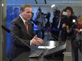 Social Democrat leader Stefan Lofven gives a media briefing after being voted back as Prime Minister on Friday Jan. 18, 2019, ending a 131-day political deadlock.  Lofven passed Friday's vote after he secured the support of the Centre and Liberal parties, forming a government without the Sweden Democrats, which has neo-Nazi roots. (Jessica Gow / TT via AP) ORG XMIT: LON810