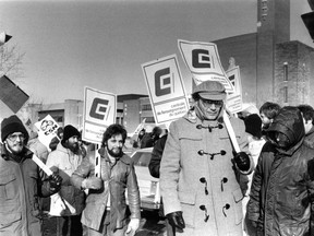 Centrale de l'enseignement du Québec head Yvon Charbonneau (wearing cap, glasses, in foreground) leads striking teachers on Jan. 26, 1983.