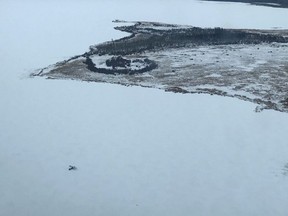 A small single-engine plane is seen on Pickerel Lake, west of Sisib Lake, Man. in this RCMP handout photo. Rescuers found a 71-year-old pilot in good spirits but suffering dehydration after mechanical trouble forced him to spend about a day stranded on a Manitoba lake.RCMP say the Ashern, Man., resident took off in a single-engine plane early Sunday morning for a camp at Sisib Lake, about 350 kilometres north of Winnipeg, but he never arrived.