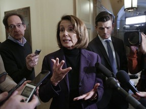 Speaker of the House Nancy Pelosi, D-Calif., takes questions from reporters, Friday, Jan. 18, 2019, on Capitol Hill in Washington.