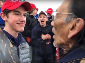 Kentucky high school students in MAGA hats mock Native American protester on Friday, Jan. 18, 2019.