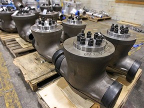Valves attached to pallets await shipping in one of Velan's plants in Montreal. The company is transferring some of its production from Montreal to India to cut costs.