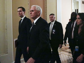 U.S. President Donald Trump's senior adviser Jared Kushner, left, walks with Vice-President Mike Pence as they leave the office of Senate Majority Leader Mitch McConnell, R-Ky., amid the partial government shutdown, in Washington, on Thursday, Jan. 17, 2019.