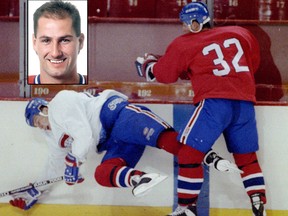 Mario Roberge dumps Lyle Odelin against the boards during training camp scrimmage at Forum in 1994.