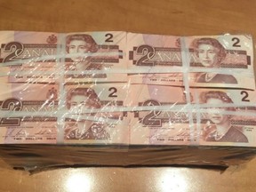 A bundle of old Canada $2 bills is shown in a handout photo.