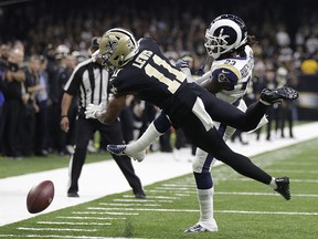 New Orleans Saints wide receiver Tommylee Lewis (11) works for a catch against Los Angeles Rams defensive back Nickell Robey-Coleman (23) Sunday, Jan. 20, 2019, in New Orleans. (AP Photo/Gerald Herbert)