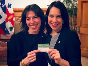 Marie-Josée Parent, left, holds her new Projet Montréal membership card with Mayor Valérie Plante on Monday, Jan. 28, 2019.