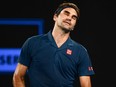 Roger Federer reacts after a point against Stefanos Tsitsipas during their match at the Australian Open in Melbourne on Sunday, Jan. 20, 2019.