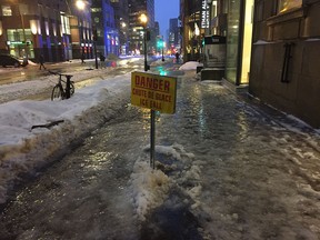 Flooded sidewalks in downtown Montreal on Jan. 24, 2019.