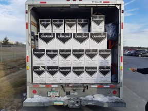 Cigarette cases jammed into the back of a U-Haul truck.