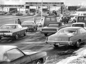 In this photo published Jan. 25, 1973, the parking lot just south of the first toll booth on the northbound Laurentian Autoroute is packed with cars, whose drivers were looking to save 15 cents.