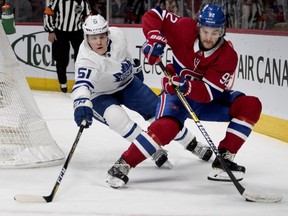 Canadiens' Jonathan Drouin tries to shake off Toronto Maple Leafs defenceman Jake Gardiner in Montreal on Feb. 9, 2019.