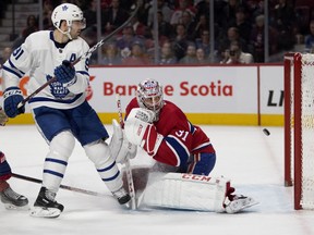 Toronto Maple Leafs' John Tavares scores in overtime against Canadiens goaltender Carey Price in Montreal on Saturday, Feb. 9, 2019.