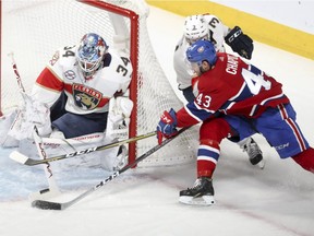 Montreal Canadiens' Michael Chaput's wraparound attempt is thwarted by Florida Panthers' James Reimer and defenceman Keith Yandle in Montreal on Jan. 15, 2019.