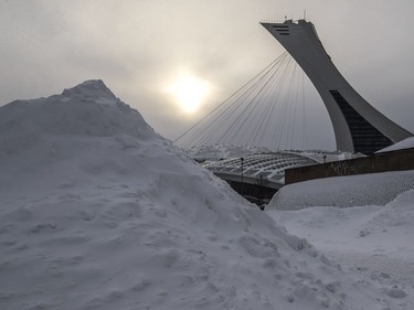 The sun sets on Olympic Stadium in Montreal on Monday January 21, 2019 following a snowstorm the previous day.