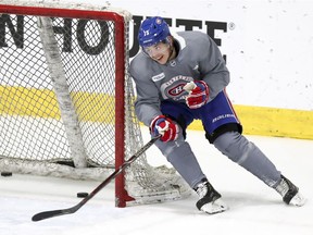 The Canadiens’ Jesperi Kotkaniemi cuts close to the goalpost as he circles the net during practice at the Bell Sports Complex in Brossard on Jan. 31, 2019.