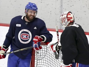 Defenceman Shea Weber has a laugh with goalie Carey Price during Montreal Canadiens practice at the Bell Sports Complex in Brossard on Jan. 31, 2019.