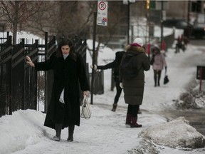 Tia Bachalany walks gingerly up an icy sidewalk on de la Montagne St.
