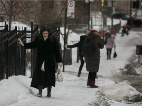 Tia Bachalany walks gingerly up an icy sidewalk on rue de la Montagne in Montreal Feb. 6, 2019.