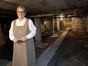 Aurore Larkin, Superior General of the Grey Nuns of Montreal, gives a tour of the vaulted cellar from the New France era, which will part of the $35-million redevelopment of the Youville Mother House in Pointe-à-Callière in Old Montreal.