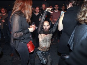 Dancer Gerard Reyes vogues through the crowd during Wednesday's Nuit Blanche programming announcement. Close to 200 activities will be presented at 140 locations during this year's edition.