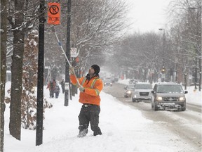 No-parking signs were going up on Iberville St. in preparation for snow removal operations on Wednesday.