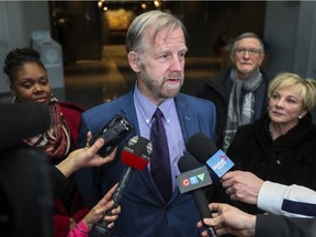 Geoffrey Chambers, president of the Quebec Community Groups Network, speaks to reporters after a meeting with Quebec Premier François Legault in Montreal on Friday, Feb. 15, 2019.