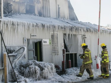 Laval firefighters at Serres Sylain Cléroux Feb. 19, 2019.  Fire destroyed most of a greenhouse and spread to other buildings.