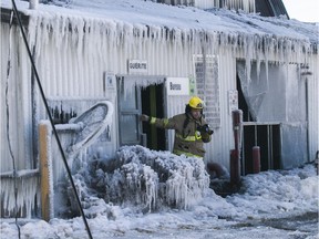 A Laval firefighter/photographer at Serres Sylain Cléroux in Laval Feb. 19, 2019.  Fire destroyed most of a greenhouse and spread to other buildings at Serres Sylvain Cléroux.