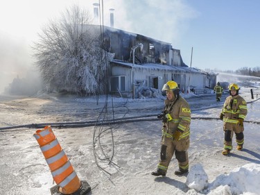 Fire destroyed most of a greenhouse and spread to other buildings at Serres Sylvain Cléroux in Laval Feb. 19, 2019.