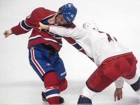 Montreal Canadiens centre Max Domi (13) engages in unnecessary fisticuffs with Columbus Blue Jackets left wing Nick Foligno (71) during the second period at the Bell Centre in Montreal on Tuesday, February 19, 2019.