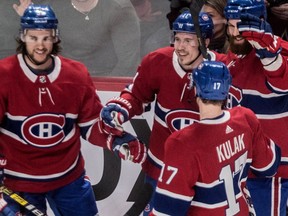 Montreal Canadiens right-wing Brendan Gallagher is congratulated by teammates after scoring against the Philadelphia Flyers during first period NHL action at the Bell Centre in Montreal on Feb. 21, 2019.