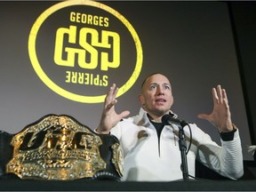 Georges St-Pierre gets expressive while announcing his retirement from UFC mixed martial arts competition at a news conference in Montreal on Thursday, Feb. 21, 2019.
