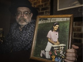 Michael Manning with a photo of his daughter, Tara, at her first communion, at his home in Beaconsfield, Feb. 22, 2019. Tara was killed in 1994.