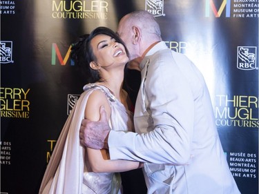 Kim Kardashian West (L) is greeted by Manfred Thierry Mugler as they arrive on the red carpet for the Thierry Mugler exhibition opening at the Montreal Museum of Fine Arts in Montreal, February 25, 2019.