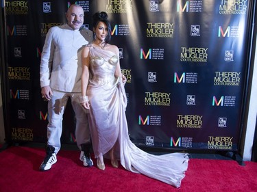 Kim Kardashian West (right) poses with Manfred Thierry Mugler as they arrive on the red carpet for the Thierry Mugler exhibition opening at the Montreal Museum of Fine Arts in Montreal, February 25, 2019.