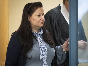 Adele Sorella walks out of meeting room with her lawyers during trial at Laval courthouse on Tuesday, Nov. 20, 2018.