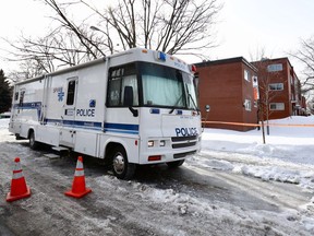 Montreal Police command post set up outside an apartment complex where a woman was murdered overnight in the Ahuntsic-Cartierville borough on Wednesday February 27, 2019.