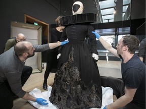 Montreal Museum of Fine Arts employees uncrate Thierry Mugler's First Which for the play MacBeth.